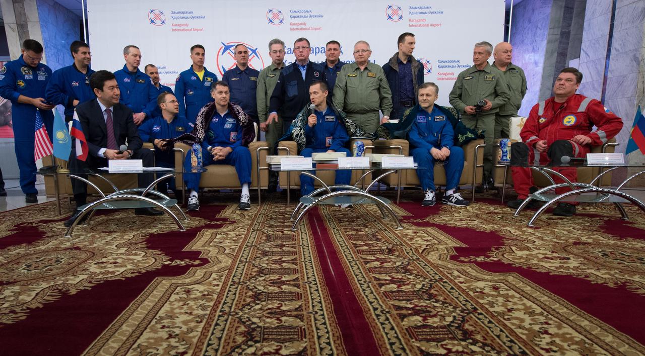 nhq201704100054 (April 10, 2017) --- Expedition 50 Commander Shane Kimbrough of NASA, left, and Flight Engineers Sergey Ryzhikov, center, and Andrey Borisenko of Roscosmos are seen at a Karaganda Airport welcome ceremony in Kazakhstan on Monday, April 10, 2017. 2017 (Kazakh time). Kimbrough, Ryzhikov, and Borisenko are returning after 173 days in space where they served as members of the Expedition 49 and 50 crews onboard the International Space Station. Photo Credit: (NASA/Bill Ingalls)