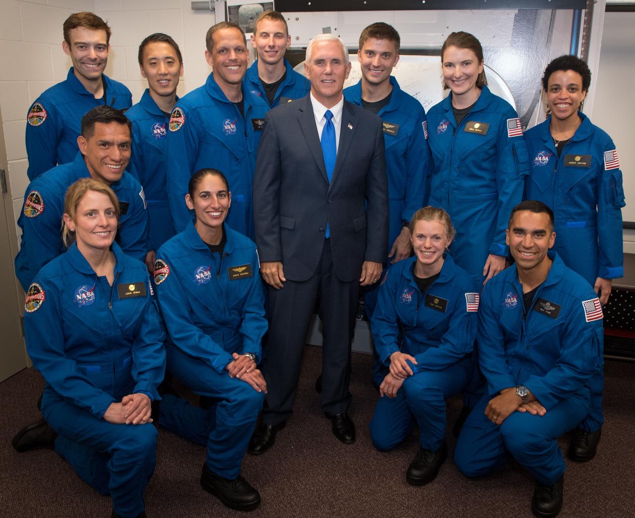 nhq201706070004 (06/07/2017) ---  Vice President Mike Pence poses for a group photograph with NASA's 12 new astronaut candidates, Wednesday, June 7, 2017 at NASA’s Johnson Space Center in Houston, Texas. NASA astronaut candidates, standing from left, Robb Kulin, Jonathan Kim, Robert Hines, Warren Hoburg, Matthew Dominick, Kayla Barron, Jessica Watkins, from left kneeling, Francisco Rubio, Loral O’Hara, Jasmin Moghbeli, Zena Cardman, and Raja Chari. After completing two years of training, the new astronaut candidates could be assigned to missions performing research on the International Space Station, launching from American soil on spacecraft built by commercial companies, and launching on deep space missions on NASA’s new Orion spacecraft and Space Launch System rocket. Photo Credit: (NASA/Bill Ingalls) Original Filename