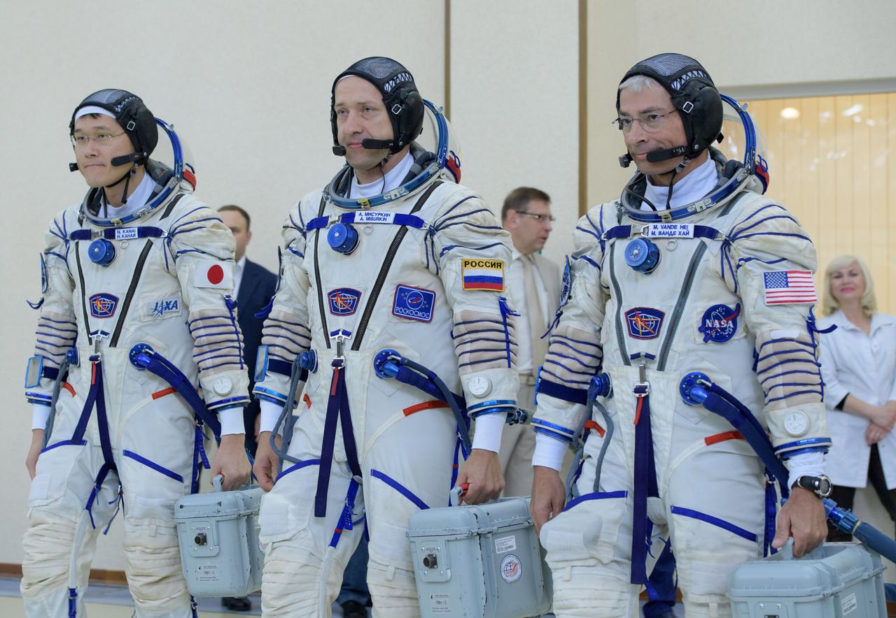 nhq2017070600100 (July 6, 2017) --- Expedition 52 backup crew members: Norishige Kanai of the Japan Aerospace Exploration Agency (JAXA), left, Alexander Misurkin of Roscosmos, center, and Mark Vande Hei of NASA begin their Soyuz qualification exams, Thursday, July 6, 2017 at the Gagarin Cosmonaut Training Center (GCTC) in Star City, Russia. Photo Credit: (NASA/Bill Ingalls)