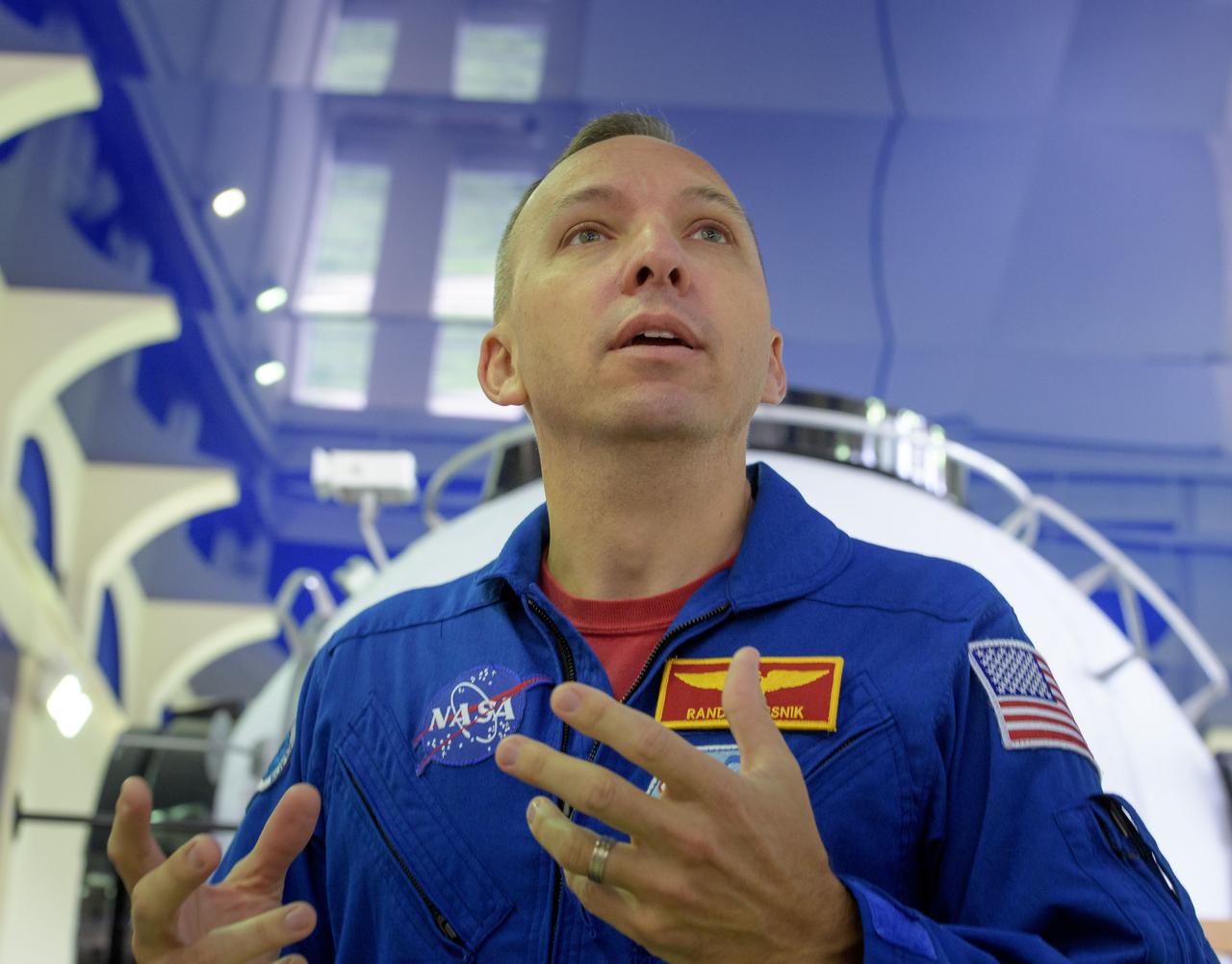 nhq2017070600107 (July 6, 2017) --- Expedition 52 flight engineer Randy Bresnik of NASA answers questions from the media as he and Paolo Nespoli of ESA, and Sergey Ryazanskiy of Roscosmos start their second to last day of qualification exams, Thursday, July 6, 2017 at the Gagarin Cosmonaut Training Center (GCTC) in Star City, Russia. Photo Credit: (NASA/Bill Ingalls)
