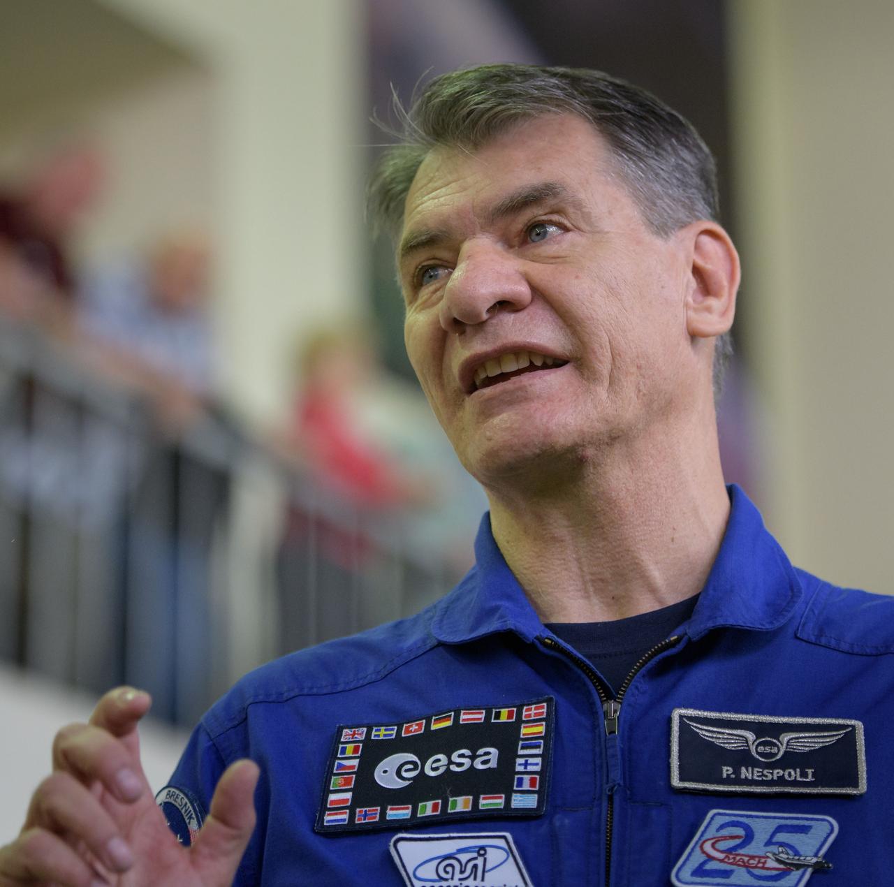 nhq2017070600110 (July 6, 2017) --- Expedition 52 flight engineer Paolo Nespoli of ESA answers questions from the media as he and \Randy Bresnik of NASA, and Sergey Ryazanskiy of Roscosmos start their second to last day of qualification exams, Thursday, July 6, 2017 at the Gagarin Cosmonaut Training Center (GCTC) in Star City, Russia. Photo Credit: (NASA/Bill Ingalls)
