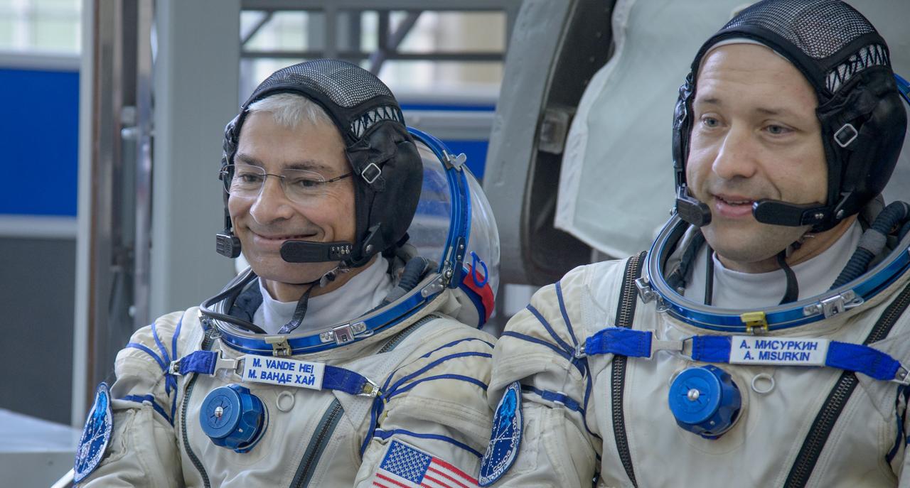 nhq2017070600118 (July 6, 2017) --- Expedition 52 backup crew members: NASA astronaut Mark Vande Hei, left, and Russian cosmonaut Alexander Misurkin of Roscosmos are seen as they answer questions from the press outside the Soyuz simulator ahead of their Soyuz qualification exams with Expedition 52 backup crew member Japan Aerospace Exploration Agency (JAXA) astronaut Norishige Kanai, Thursday, July 6, 2017 at the Gagarin Cosmonaut Training Center (GCTC) in Star City, Russia. Photo Credit: (NASA/Beth Weissinger)