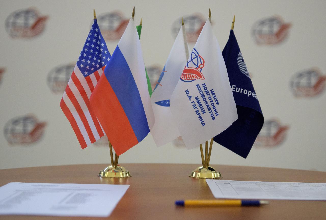 nhq201707070002 (July 7, 2017) --- Flags representing the United States, Russia, Italy, NASA, ESA, and the Roscosmos Gagarin Cosmonaut Training Center (GCTC) are seen on table during the Expedition 52 Soyuz qualification exams, Friday, July 7, 2017 at the Gagarin Cosmonaut Training Center (GCTC) in Star City, Russia. Photo Credit: (NASA/Bill Ingalls)