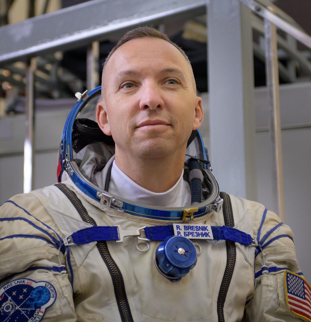 nhq201707070006 (July 7, 2017) --- Expedition 52 flight engineer Randy Bresnik of NASA listens to questions from the press outside the Soyuz simulator ahead his final Soyuz qualification exam with fellow Expedition 52 flight engineers Sergey Ryazanskiy of Roscosmos, and Paolo Nespoli of ESA, Friday, July 7, 2017 at the Gagarin Cosmonaut Training Center (GCTC) in Star City, Russia. Photo Credit: (NASA/Bill Ingalls)