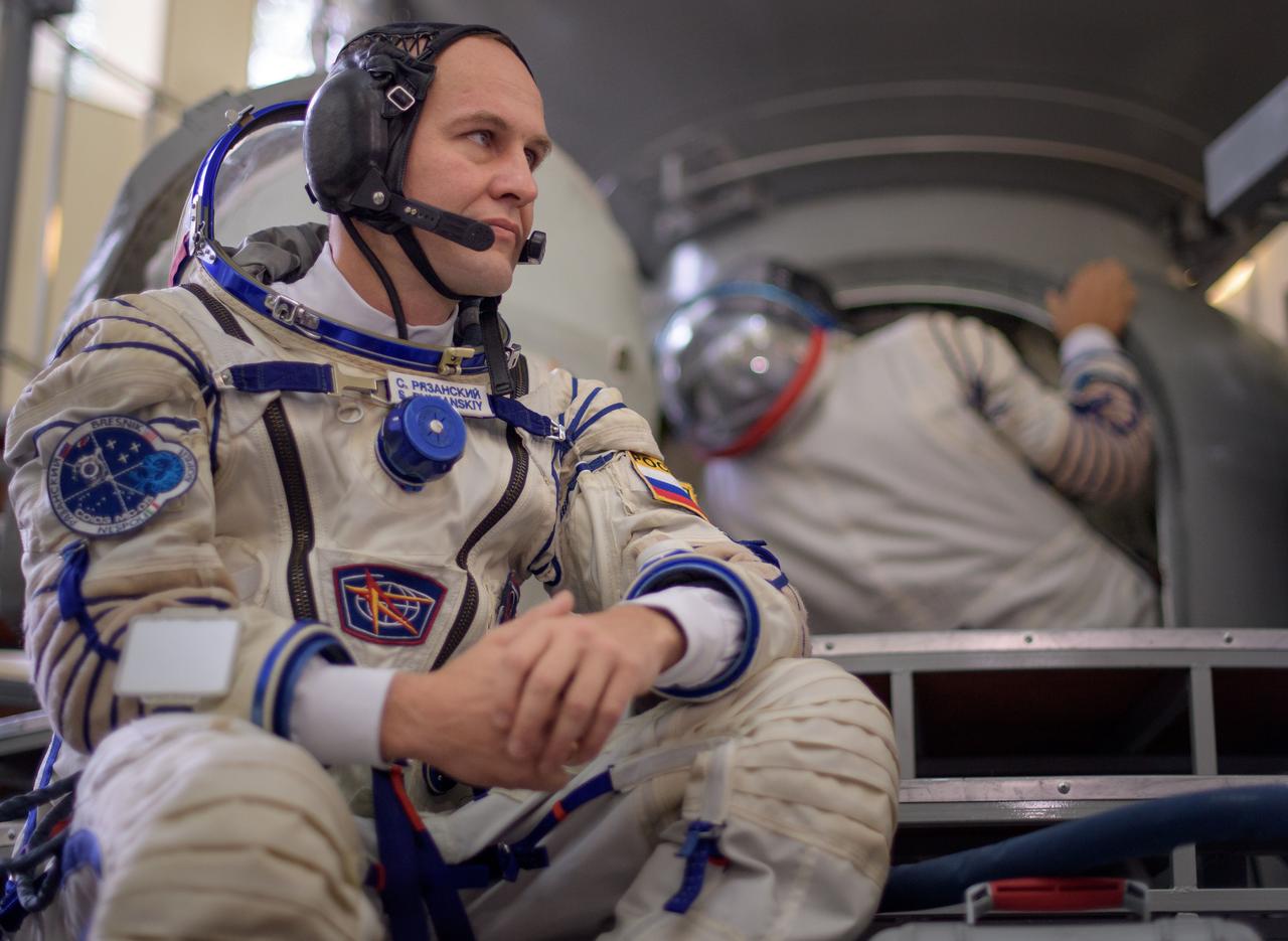 nhq201707070014 (July 7, 2017) --- Expedition 52 flight engineer Sergey Ryazanskiy of Roscosmos waits to enter the Soyuz simulator ahead his final Soyuz qualification exam with fellow Expedition 52 flight engineers Paolo Nespoli of ESA, background, and Randy Bresnik of NASA, Friday, July 7, 2017 at the Gagarin Cosmonaut Training Center (GCTC) in Star City, Russia. Photo Credit: (NASA/Bill Ingalls)