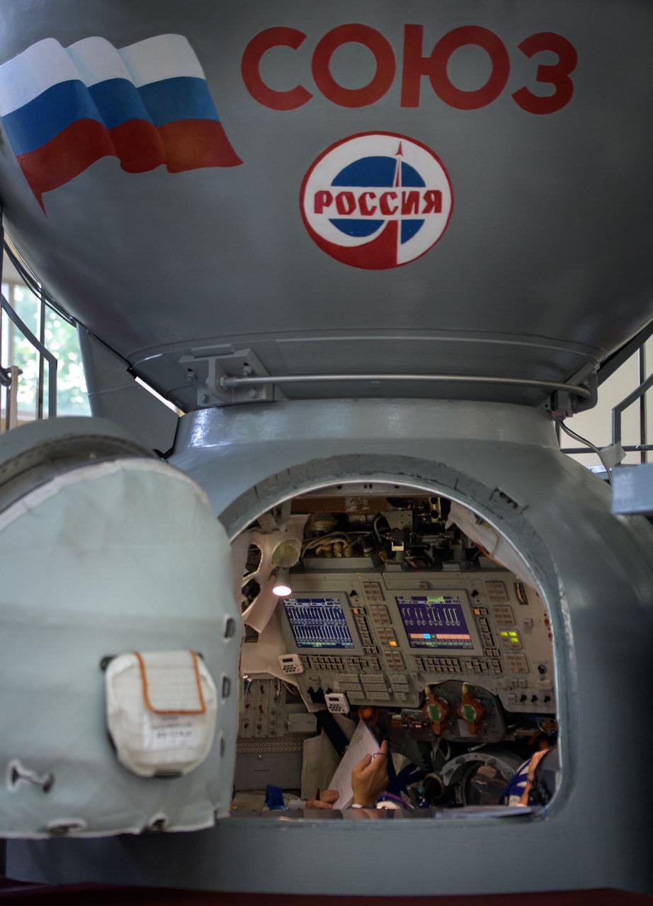 nhq201707070019 (July 7, 2017) --- Expedition 52 flight engineers Sergey Ryazanskiy of Roscosmos, Randy Bresnik of NASA, and Paolo Nespoli of ESA are in the Soyuz simulator for their final Soyuz qualification exam, Friday, July 7, 2017 at the Gagarin Cosmonaut Training Center (GCTC) in Star City, Russia. Photo Credit: (NASA/Bill Ingalls)