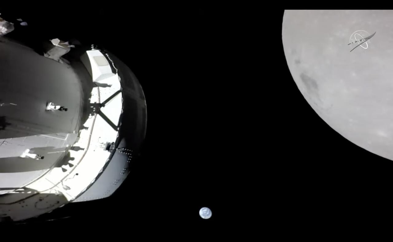 On Nov. 21, 2022, a camera on Orion's solar array wing captured this view of the spacecraft, the Earth and the Moon. Orion was making its outbound powered flyby of the Moon as part of the Artemis I mission, approaching within 80 miles of the lunar surface. Artemis I, the first flight test of NASA's Orion capsule and Space Launch System rocket, launched Nov. 16, 2022, and is scheduled to splashdown Dec. 11.