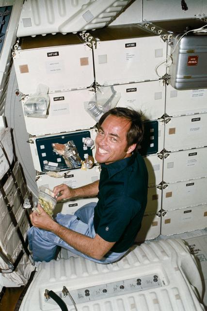 NASA image: Pilot Crippen prepares meal on middeck