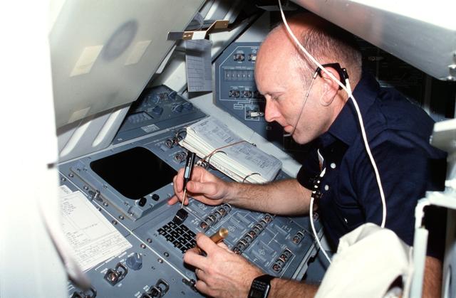 NASA image: Pilot Fullerton repairs keyboard on Aft Flight Deck control panel R12L