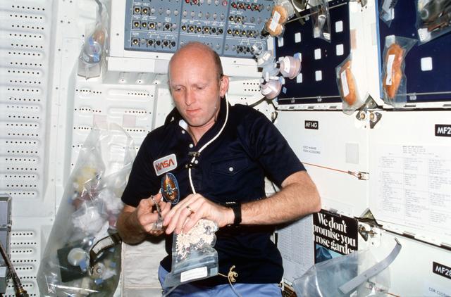 NASA image: Pilot Fullerton prepares meal on middeck