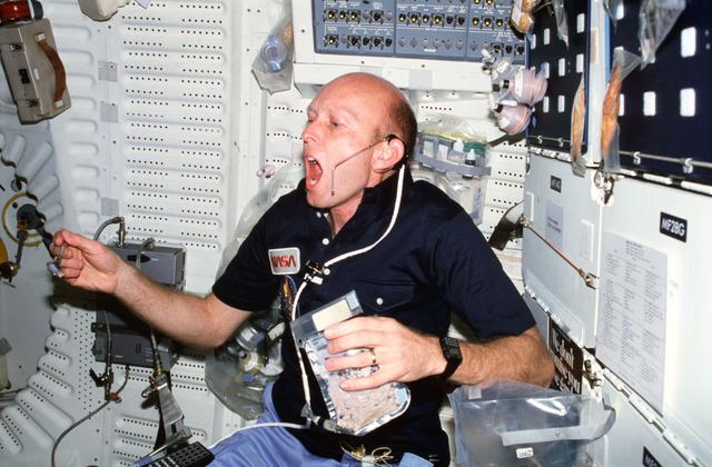 NASA image: Pilot Fullerton eats on middeck