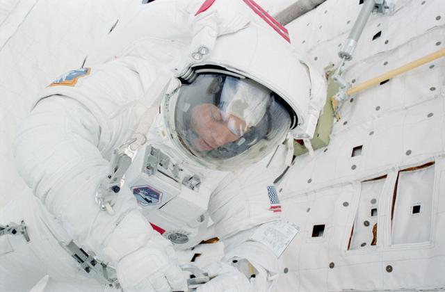 NASA image: Mission Specialist (MS) Musgrave works at PLB forward bulkhead during EVA