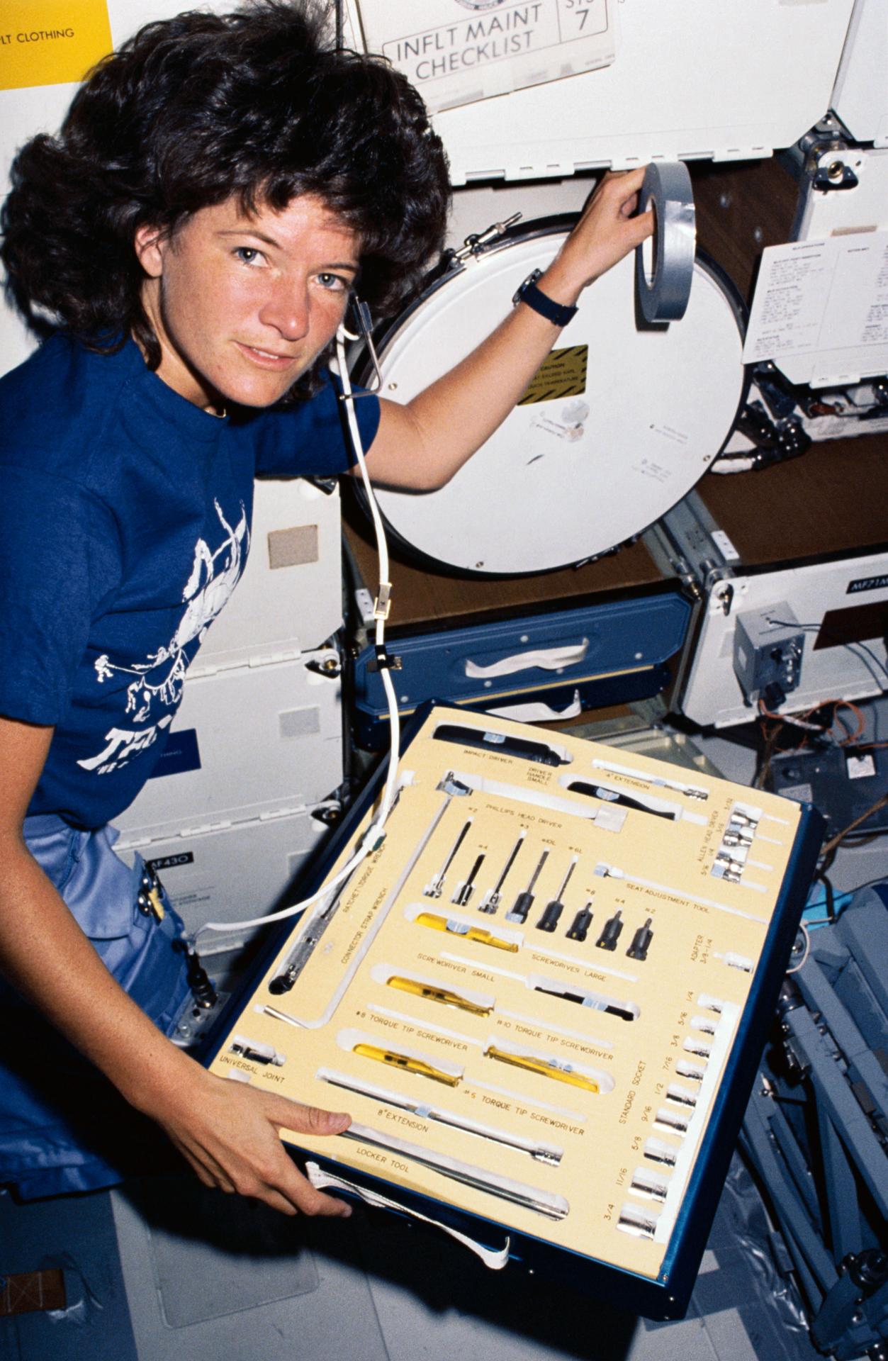 Sally Ride with tools onboard STS-7