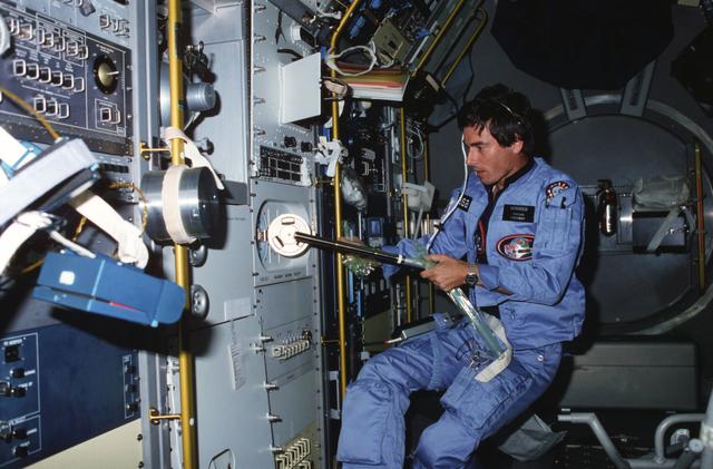 NASA image: Payload specialist Merbold performing experiment in Spacelab