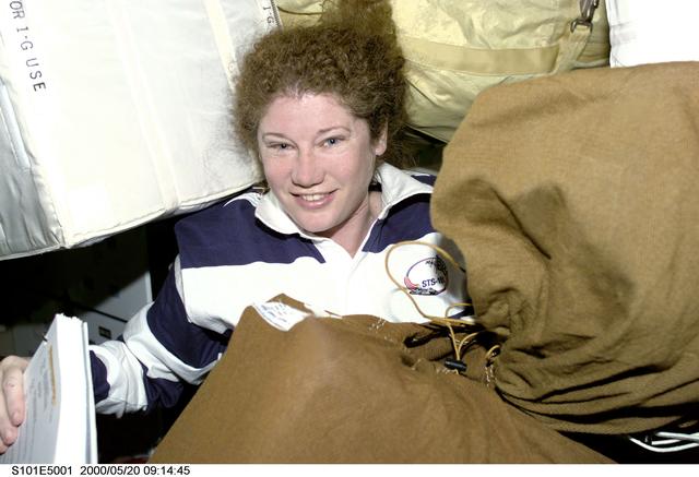 NASA image: MS Helms with stowage items on the middeck