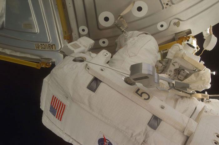 STS102-E-5124 (11 March 2001) --- Astronaut Susan J. Helms works at the Destiny laboratory during the first STS-102 space walk. This extravehicular activity (EVA) by mission specialists Helms and James S. Voss, two thirds of the exchange crew for the International Space Station (ISS), will be followed by another space walk involving two other STS-102 mission specialists.  This photo was taken with a digital still camera.
