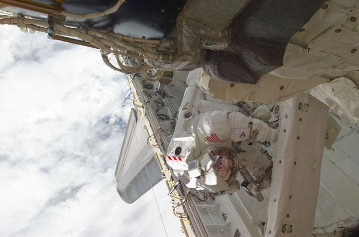 STS102-E-5163 (13 March 2001) --- Astronaut Paul W. Richards, mission specialist, is pictured in Discovery's cargo bay during the second STS-102 space walk.  The photograph was taken with a digital still camera.