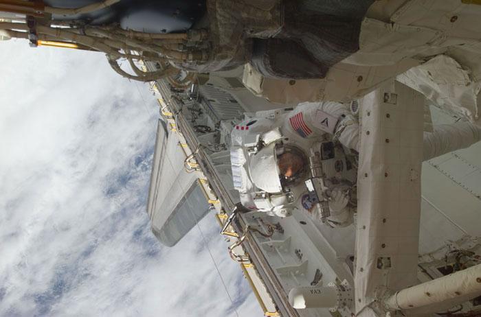 STS102-E-5166 (13 March 2001) --- Astronaut Paul W. Richards, mission specialist, uses a hand tool during the second STS-102 space walk.  The photograph was taken with a digital still camera.