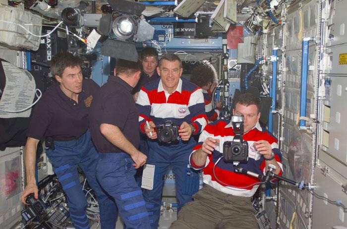 STS102-E-5223 (16 March 2001) --- Cameras are plentiful in this digital still camera's image of astronauts and cosmonauts on the International Space Station (ISS).  From the left are cosmonauts Sergei K. Krikalev and Yuri P. Gidzenko of Rosaviakosmos; along with astronauts William M. (Bill) Shepherd, James S. Voss, Susan J. Helms (background) and James. M. Kelly.   Shepherd, Gidzenko and Krikalev  have been aboard the orbital outpost since  early November 2000 and are just days away from return to Earth.  Helms and  Voss are about to begin a lengthy stay aboard the station as flight engineers.  Kelly is pilot for the STS-102 crew.