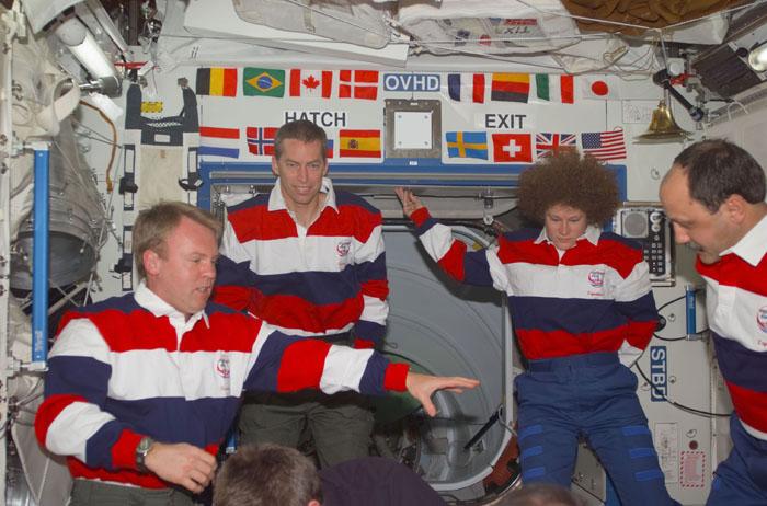 STS102-E-5224 (16 March 2001) --- Onboard the Destiny laboratory on the International Space Station (ISS), astronauts and cosmonauts convene in the midst of personnel changes on crew assignments.  From the left are astronauts Andrew S.W. Thomas, James D. Wetherbee and Susan J. Helms; and cosmonaut Yury V. Usachev of Rosaviakosmos.  Though all are wearing STS-102 attire, Helms and Usachev will be dressed in that of the Expedition Two crew shortly.  The photo was taken with a digital still camera.