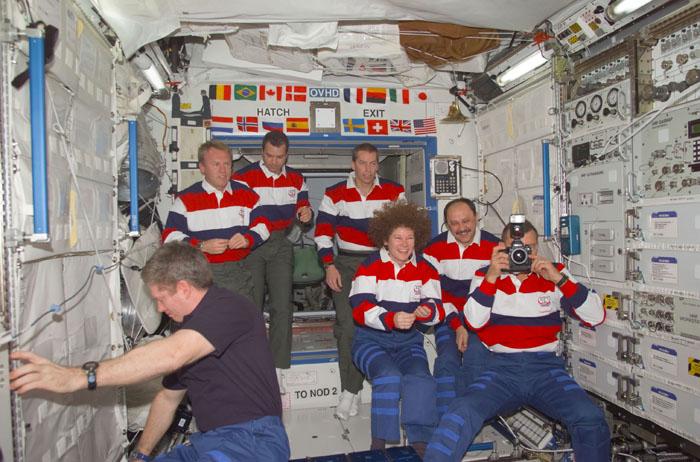 STS102-E-5227 (16 March 2001) --- Onboard the Destiny laboratory on the International Space Station (ISS), astronauts and cosmonauts convene in the midst of personnel changes on crew assignments.  From the left are astronauts William M. (Bill) Shepherd, Andrew S.W. Thomas, Paul W. Richards, James D. Wetherbee and Susan J. Helms;  along with cosmonaut Yury V. Usachev of Rosaviakosmos and astronaut James S. Voss.  Though six here are wearing STS-102 attire, Helms, Voss and Usachev will be dressed in that of the Expedition Two crew shortly and Shepherd's suit will match those of the STS-102 crew members.   The photo was taken with a digital still camera.
