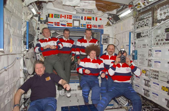 STS102-E-5228 (16 March 2001) --- Onboard the Destiny laboratory for the International Space Station (ISS), astronauts and cosmonauts convene in the midst of personnel changes on crew assignments.  From the left are astronauts William M. (Bill) Shepherd, Andrew S.W. Thomas, Paul W. Richards, James D. Wetherbee and Susan J. Helms;  along with cosmonaut Yury V. Usachev of Rosaviakosmos and astronaut James S. Voss.  Though six here are wearing STS-102 attire, Helms, Voss and Usachev will be dressed in that of the Expedition Two crew shortly and Shepherd's suit will match those of the STS-102 crew members.   The photo was taken with a digital still camera.