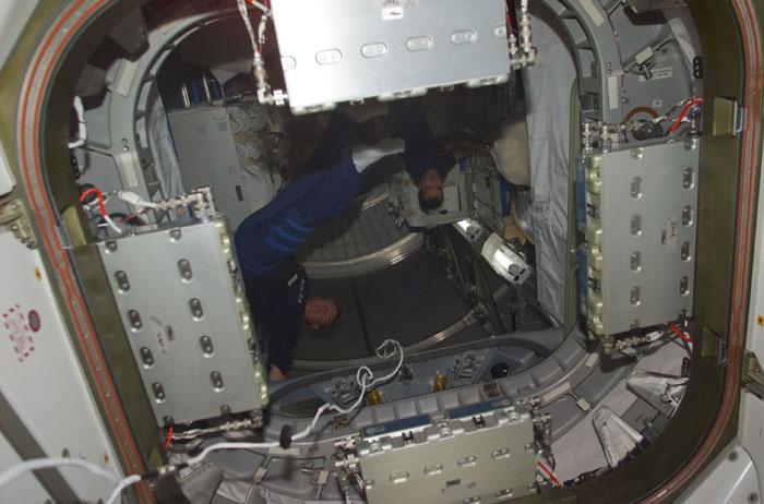 STS102-E-5239 (17 March 2001) --- Astronauts Andrew S.W. Thomas (left) and Paul W. Richards, STS-102 mission specialists, are at work in the Leonardo  cargo module.  The image was recorded with a digital still camera.