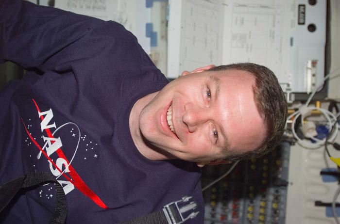 STS102-E-5287 (17 March 2001) --- Astronaut James M. Kelly, pilot, takes a brief pause on the flight deck of the Space Shuttle Discovery as he and his STS-102 crew mates move toward the end of joint activities with the crew of the International Space Station (ISS).   The image was recorded with a digital still camera.