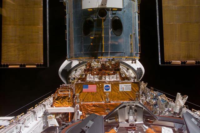 S103-E-5169 (21 December 1999) --- This electronic still camera's view and others in this series showing the Hubble Space Telescope (HST) berthed in Discovery's bay were recorded during capture and downlinked at the completion of the mission's first space walk on the following day by the busy STS-103 astronauts. The image was recorded at 19:49:22 GMT, Dec. 21, 1999.