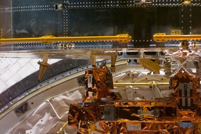 S103-E-5170 (21 December 1999) --- This closeup electronic still camera's view shows the lower portion of the Hubble Space Telescope (HST) as the giant observatory is berthed in Discovery's cargo bay. The gold-shielded apparatus at the bottom of the frame is the flight support system (FSS), a turntable device similar to a &quot;Lazy Susan&quot; because of its ability to rotate and tilt to assist the upcoming servicing tasks. The image was recorded at 19:49:22 GMT, Dec. 21, 1999 but was not  able to be downlinked by the astronauts until late on the following day.