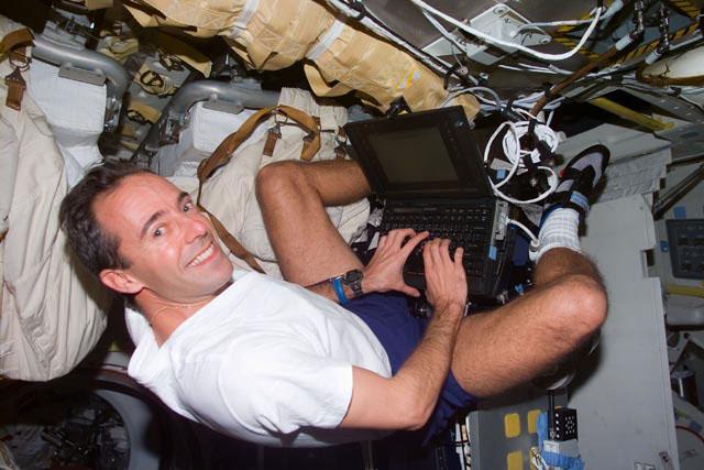 S103-E-5189 (21 December 1999) --- Astronaut Jean-Francois Clervoy, mission specialist representing the European Space Agency (ESA), uses a  general purpose computer on Discovery's mid deck. This photo was taken with an  electronic still camera (ESC) at 10:43:55 GMT, Dec. 21, 1999.