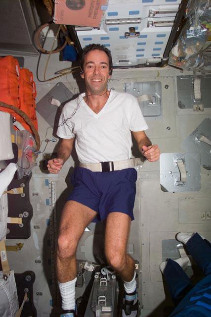 S103-E-5190  (21 December 1999) --- Astronaut Jean-Francois Clervoy, mission specialist representing the European Space Agency (ESA), works out on an ergometer on Discovery's mid deck. This photo was taken with an electronic still camera (ESC) at 11:02:27 GMT, Dec. 21, 1999.