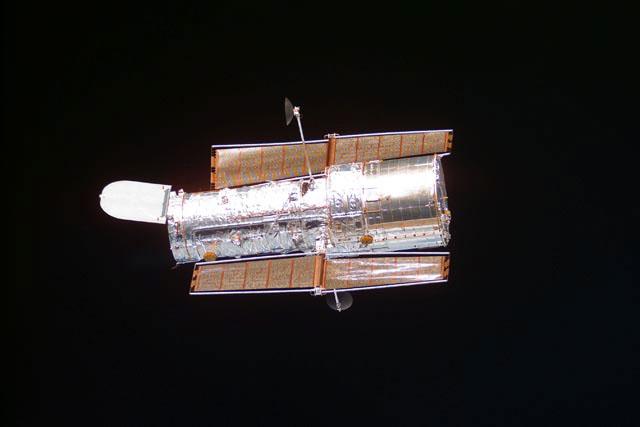 S103-E-5454 (25 December 1999) --- Moments after the freeing of the Hubble Space Telescope (HST) by Discovery's remote manipulator system (RMS), astronauts in the shuttle's cabin took a series of electronic stills of the   giant observatory.