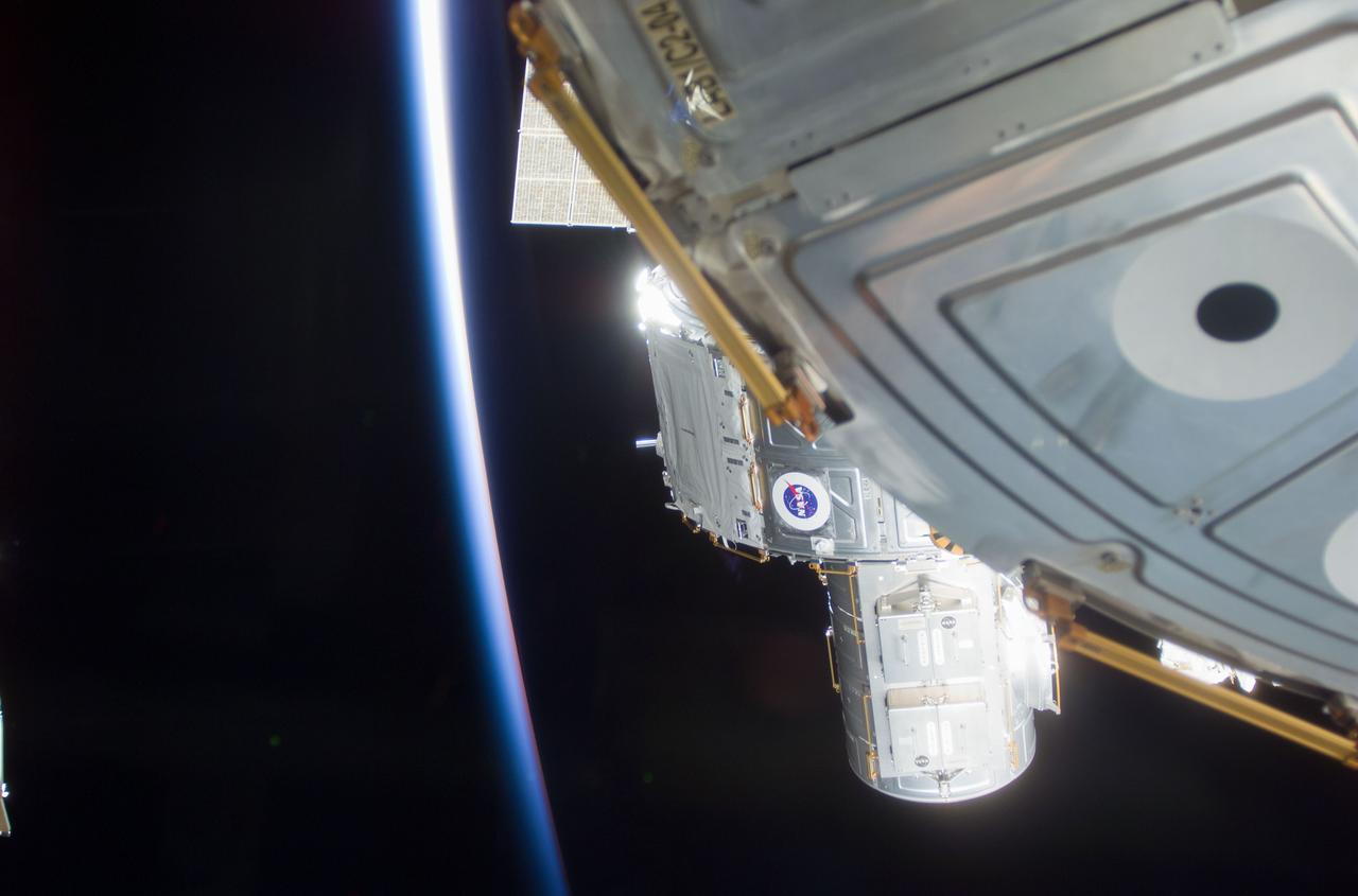 S104-E-5071 (15 July 2001) --- As the sun sets behind the Earth's horizon, the Expedition Two and STS-104 crews continue to install the Quest Airlock onto the starboard side of Unity Node 1.  Susan J. Helms, Expedition Two flight engineer, working in the Destiny U.S. Laboratory, maneuvered the Airlock into place with the Canadarm2, Space Station Remote Manipulator System (SSRMS), while being assisted by Michael L. Gernhardt and James F. Reilly, STS-104 mission specialists, during their first extravehicular activity (EVA).