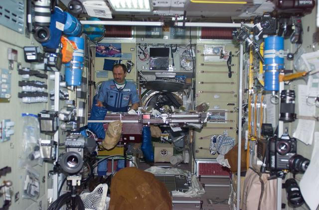 NASA image: Usachev at ward room table in Service Module