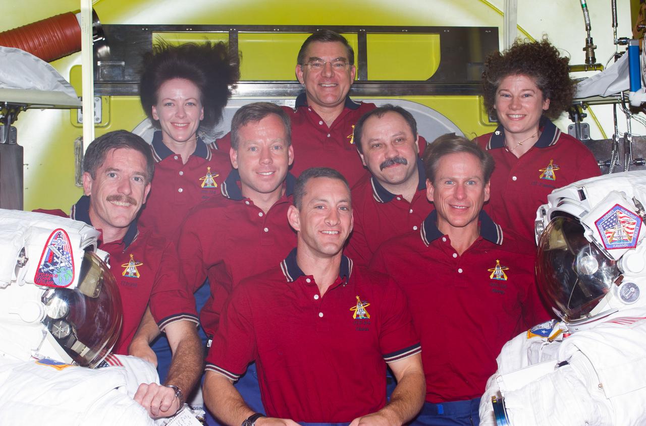 STS104-E-5178 (20 July 2001) --- Seven astronauts and a cosmonaut representing Rosaviakosmos take a break in joint activities involving the Expedition Two and STS-104 crews to pose for an inflight portrait in the newly delivered Quest Airlock on the International Space Station (ISS).   Charles O. Hobaugh is in front.  On the second row are, from the left, James F. Reilly,  Steven W. Lindsey, Yury V. Usachev and   Michael L. Gernhardt. In the rear are  astronauts Janet L. Kavandi, James S. Voss and Susan J. Helms.  Usachev, commander; along with Voss and Helms, both flight engineers, comprise the Expediton Two crew.  Lindsey is STS-104  commander, with Hobaugh serving as pilot.  Kavandi, STS-104 flight engineer, is joined by Gernhardt and Reilly as mission specialists on the mission. This image was recorded with a digital still camera.