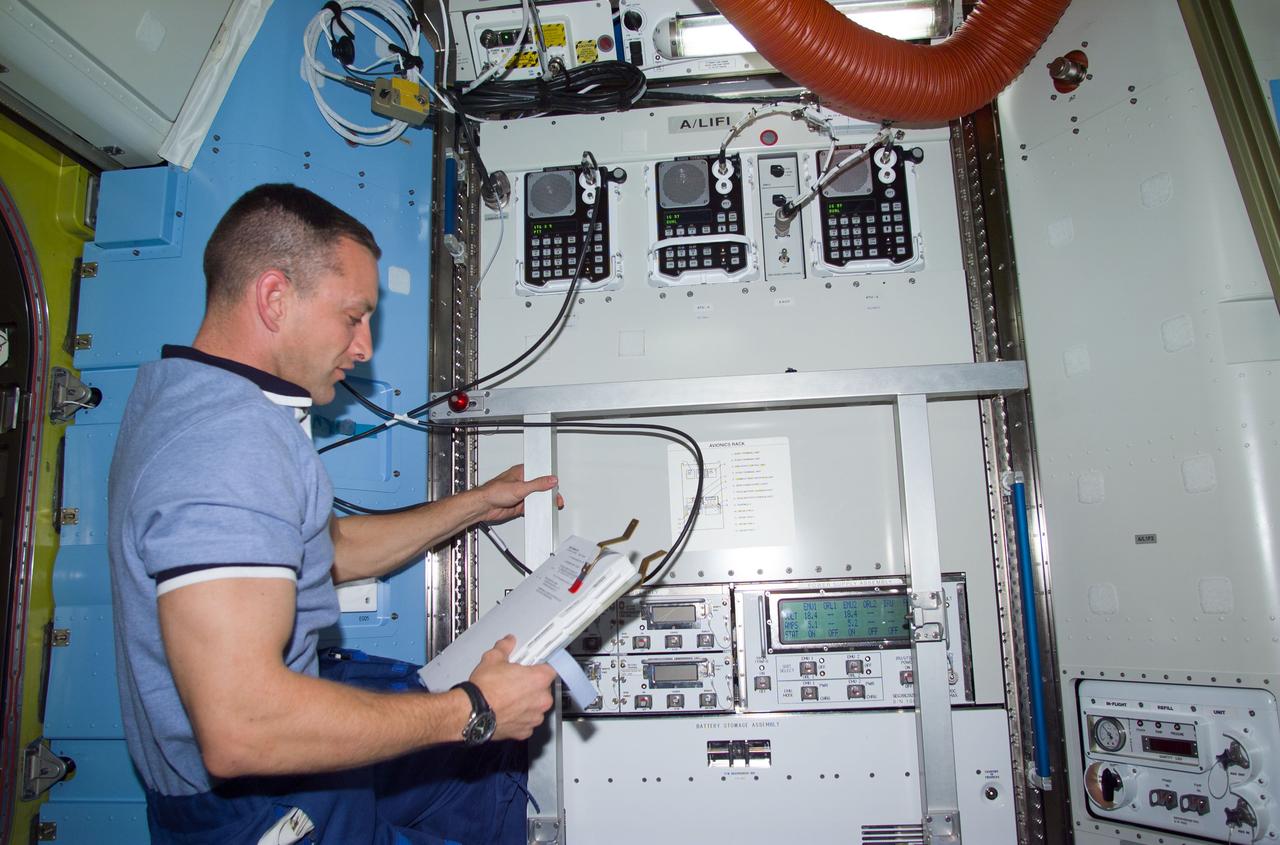 STS104-E-5211 (20 July 2001) ---  Astronaut Charles O. Hobaugh,  pilot, checks the new Umbilical Interface Assembly and other hardware in the new Equipment Lock of the Airlock Quest prior to the start of the third and final STS-104 space walk.  The image was recorded with a digital still camera.