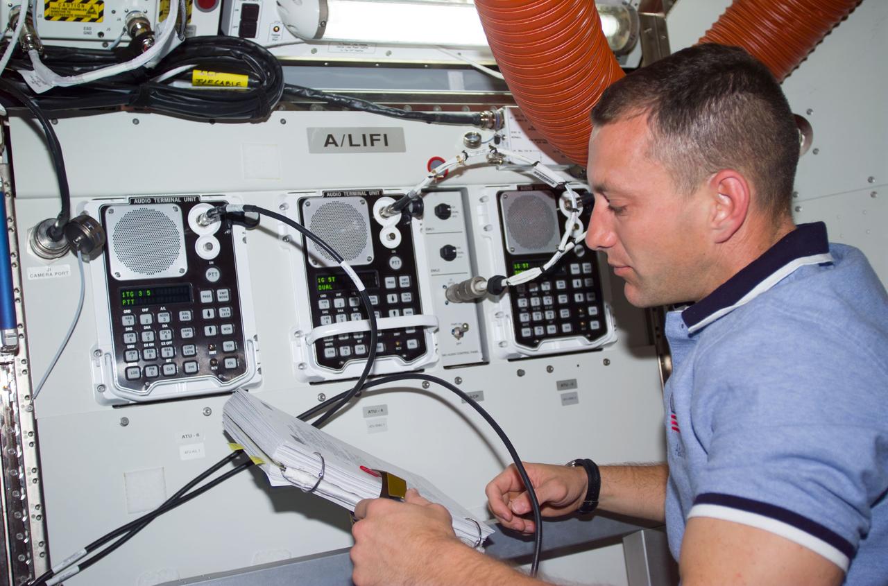 STS104-E-5218 (20 July 2001) ---  Astronaut Charles O. Hobaugh,  pilot, checks the new Umbilical Interface Assembly and other hardware in the new Equipment Lock of the Airlock Quest prior to the start of the third and final STS-104 space walk.  The image was recorded with a digital still camera.