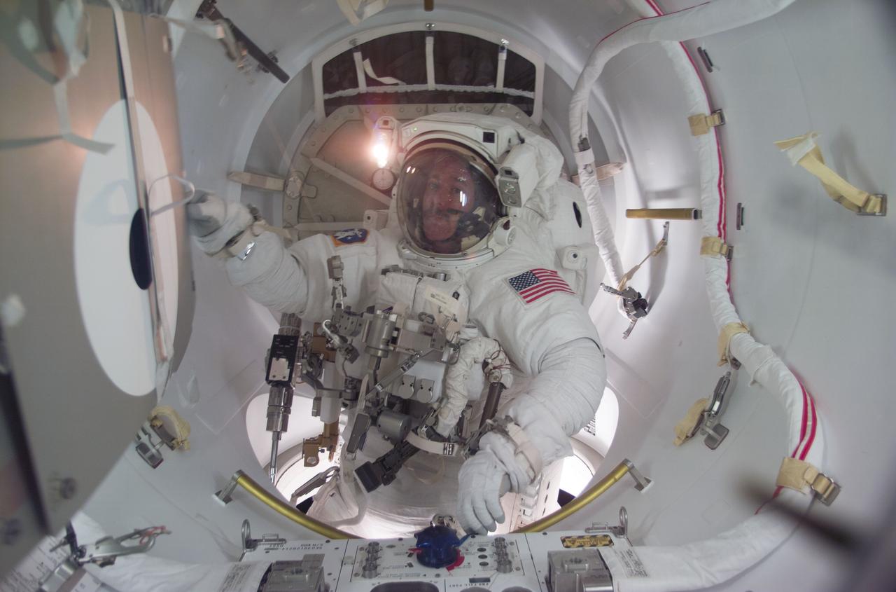 STS104-E-5232 (21 July 2001) --- A crew member used a digital still camera to take a  picture of astronaut James F. Reilly in the airlock at the completion of the final STS-104 extravehicular activity (EVA).
