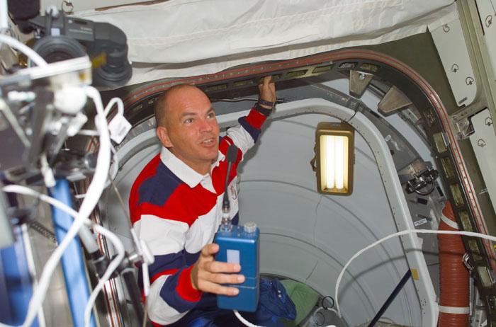 S105-E-5100 (12 August 2001) --- Frederick W. Sturckow, STS-105 pilot, moves through Pressurized Mating Adapter 2 (PMA-2) and into the Destiny Laboratory during STS-105's initial ingress into the International Space Station (ISS).  This is Sturckow's second visit to the ISS.  This image was taken with a digital still camera.