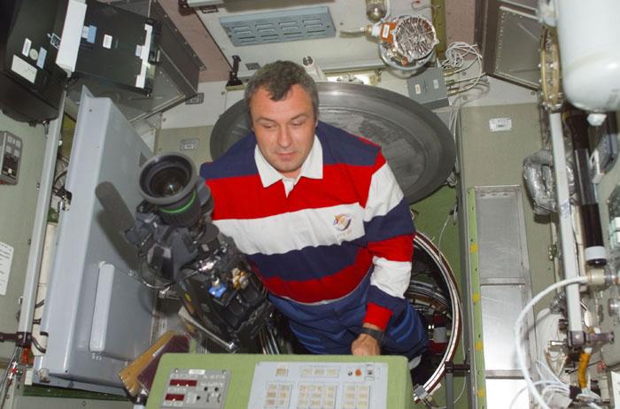 STS-105-E-5125 (12 August 2001) --- Vladimir N. Dezhurov of Rosaviakosmos, Expedition Three flight engineer, enters the Zvezda Service Module carrying a high definition camera during the initial ingress into the International Space Station (ISS) for the STS-105 mission.  Dezhurov, accompanied by cosmonaut Mikhail Tyurin and astronaut Frank L. Culbertson,  Jr. will be replacing astronauts Susan J. Helms and James S. Voss and cosmonaut Yury V. Usachev as the temporary residents on the ISS.  This image was taken with a digital still camera.