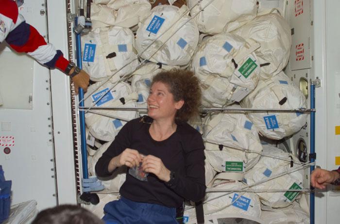 STS105-E-5152 (12 August 2001) --- Astronaut Susan J. Helms, Expedition Two flight engineer, is positioned near a large amount of water temporarily stored in the Unity node aboard the International Space Station (ISS). The photo was taken with a digital still camera by one of the STS-105 crew members currently visiting the ISS.  Helms will accompany the shuttle crew back to Earth after having spent five months with two crew mates aboard the orbital outpost.