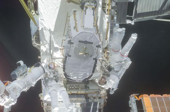 STS105-E-5269 (16 August 2001) --- Astronauts Daniel T. Barry (left) and Patrick G. Forrester work with the Early Ammonia Servicer (EAS), which they are in the process of installing on a segment of the P6 structure on the International Space Station (ISS). The two mission specialists were participating in the first of two scheduled STS-105 space walks.  The image was recorded with a digital still camera.