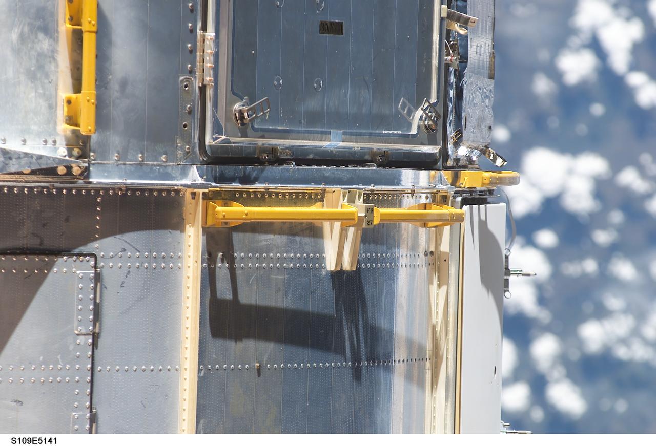 STS109-E-5141 (3 March 2002)  ---  Astronauts will find these handrails on the Hubble Space Telescope very helpful during a series of scheduled space walks throughout the coming week.  STS-109 crew members used a digital still camera, as well as other cameras, to survey and document various areas on the giant telescope.  This mission marks the fourth shuttle visit to the Hubble since its deployment in April of 1990.