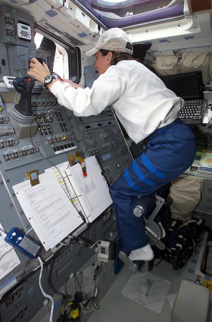 NASA image: MS Currie at RMS controls on aft flight deck