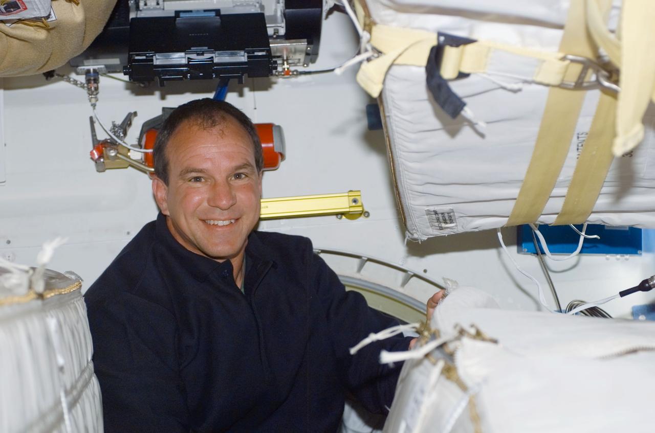 STS110-E-5033 (8 April 2002) --- Astronaut Michael J. Bloomfield, STS-110 mission commander, is photographed on the mid deck of the Space Shuttle Atlantis. The image was taken with a digital still camera.