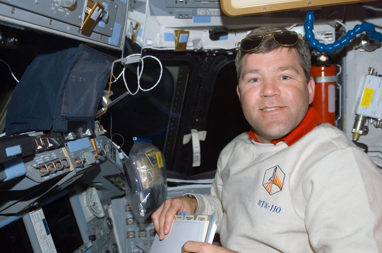 STS110-E-5060 (9 April 2002) --- Astronaut Stephen N. Frick, STS-110 pilot, occupies the pilot’s station on the forward flight deck of the Space Shuttle Atlantis. The image was taken with a digital still camera.