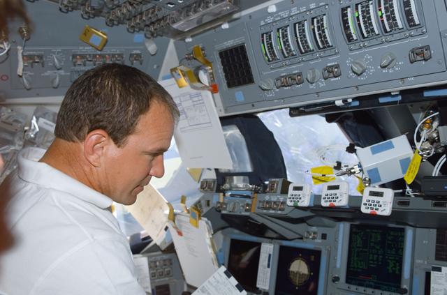 NASA image: Commander Bloomfield works at the commander's workstation on the flight deck during STS-110