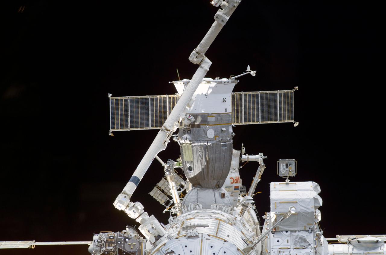 STS110-E-5069 (9 April 2002) --- During the docking approach of the Space Shuttle Atlantis to the International Space Station (ISS), a STS-110 crewmember photographed this close-up view of the orbital outpost with a digital still camera. A Soyuz vehicle, docked to the station, was visible behind the Canadarm2.