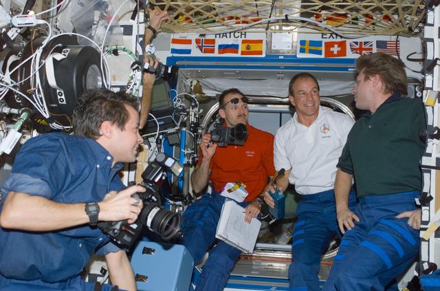 NASA image: Expedition Four and STS-110 crews congregate in Destiny